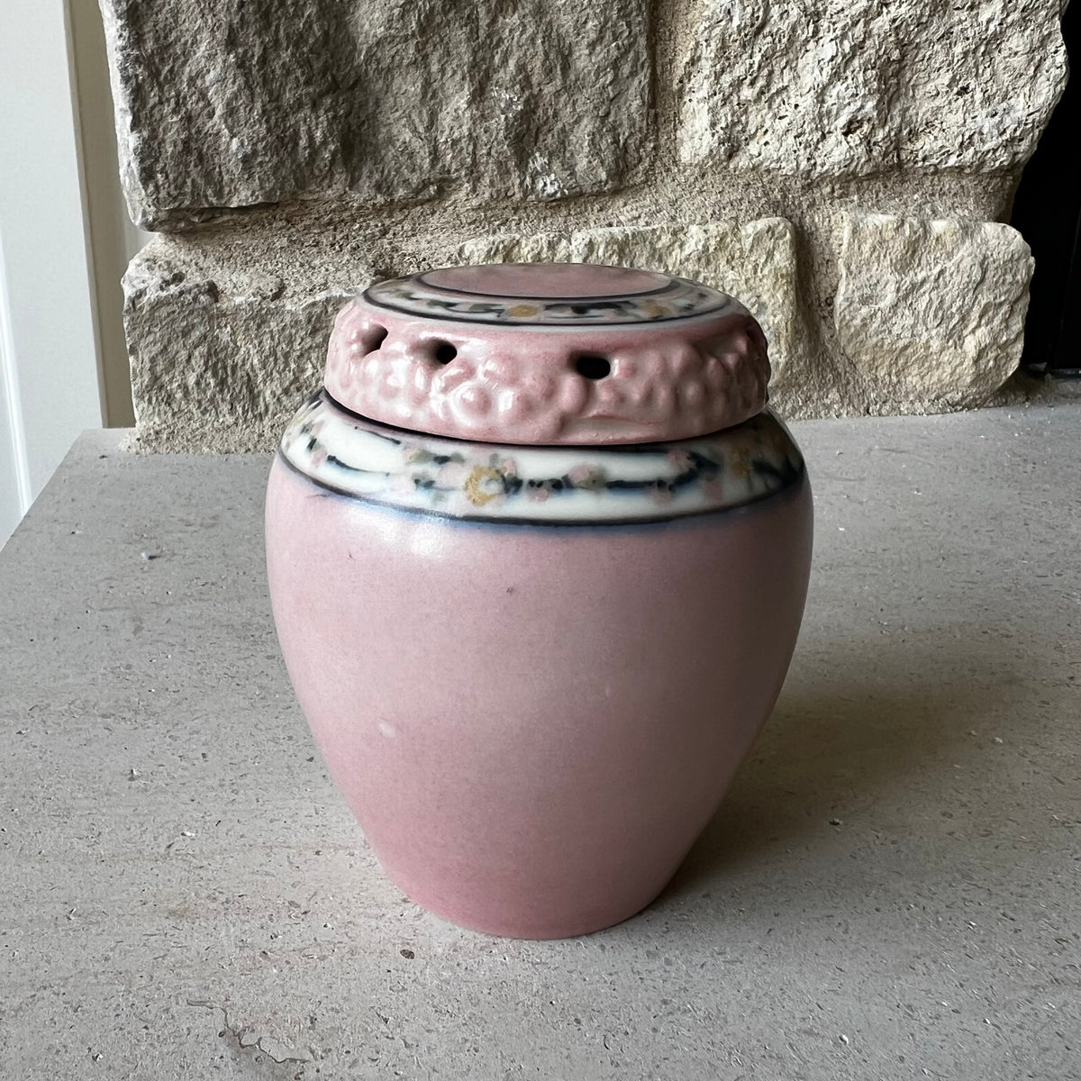 Rookwood Pottery jar with pierced lid, 1922, attributed to E.T. Hurley, pink with floral band