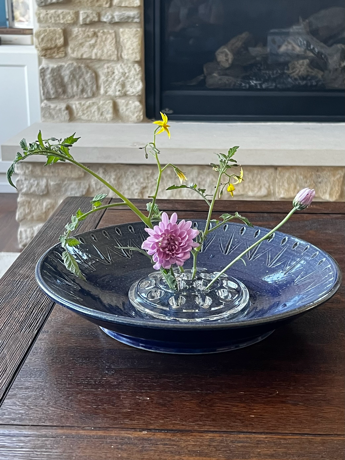 Clear glass flower frog in cobalt blue bowl, pink chrysanthemum and wildflower stems