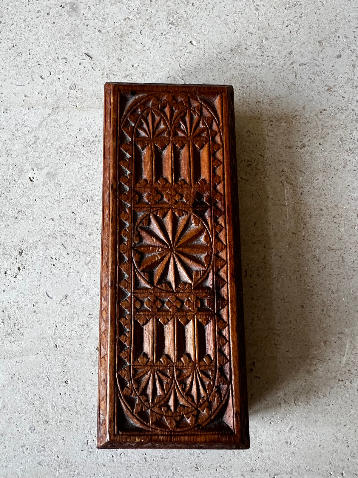    Vintage hand-carved wooden box with geometric rosette design