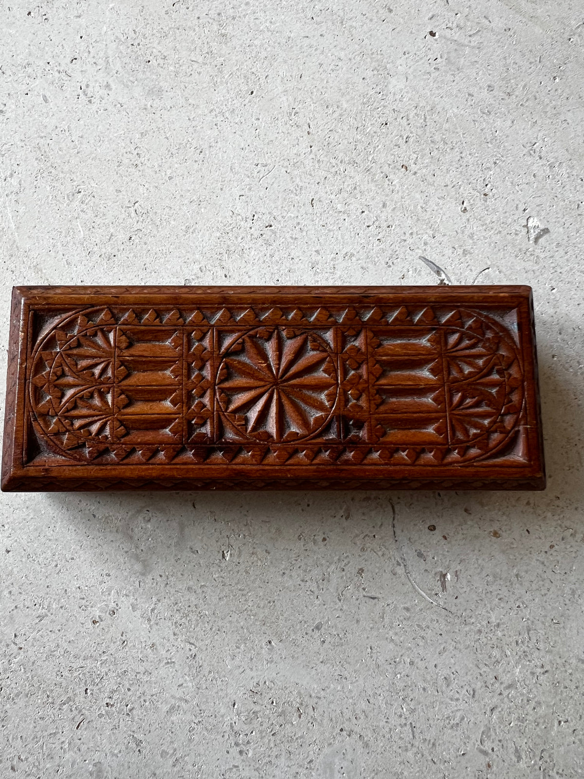     Hand-carved geometric detailing on vintage wooden keepsake box