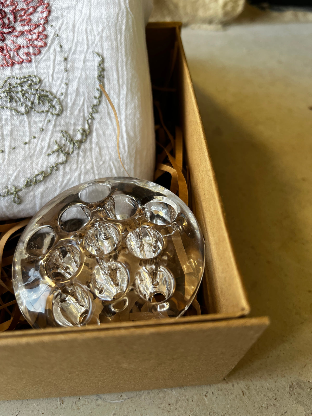 Round clear pressed glass flower frog, multiple holes, in kraft gift box with shred