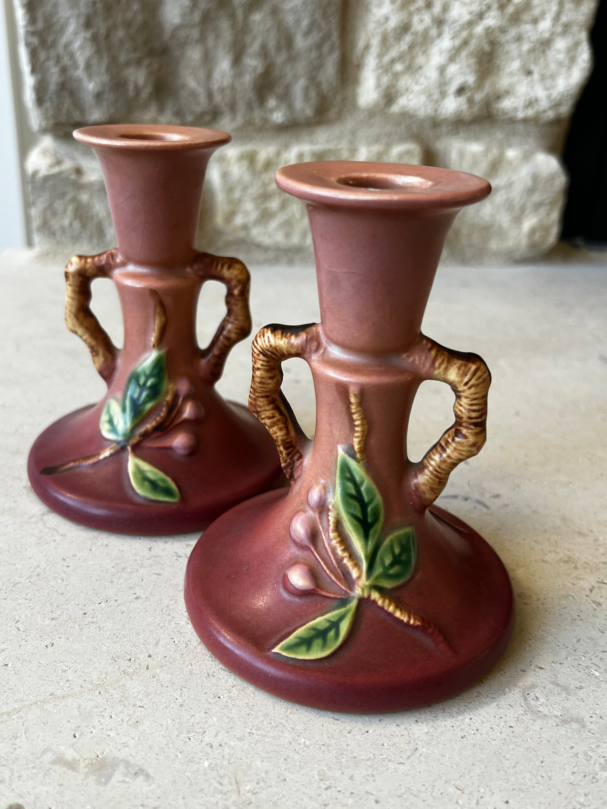 Pair of vintage Roseville Apple Blossom candlesticks in dusty rose and green